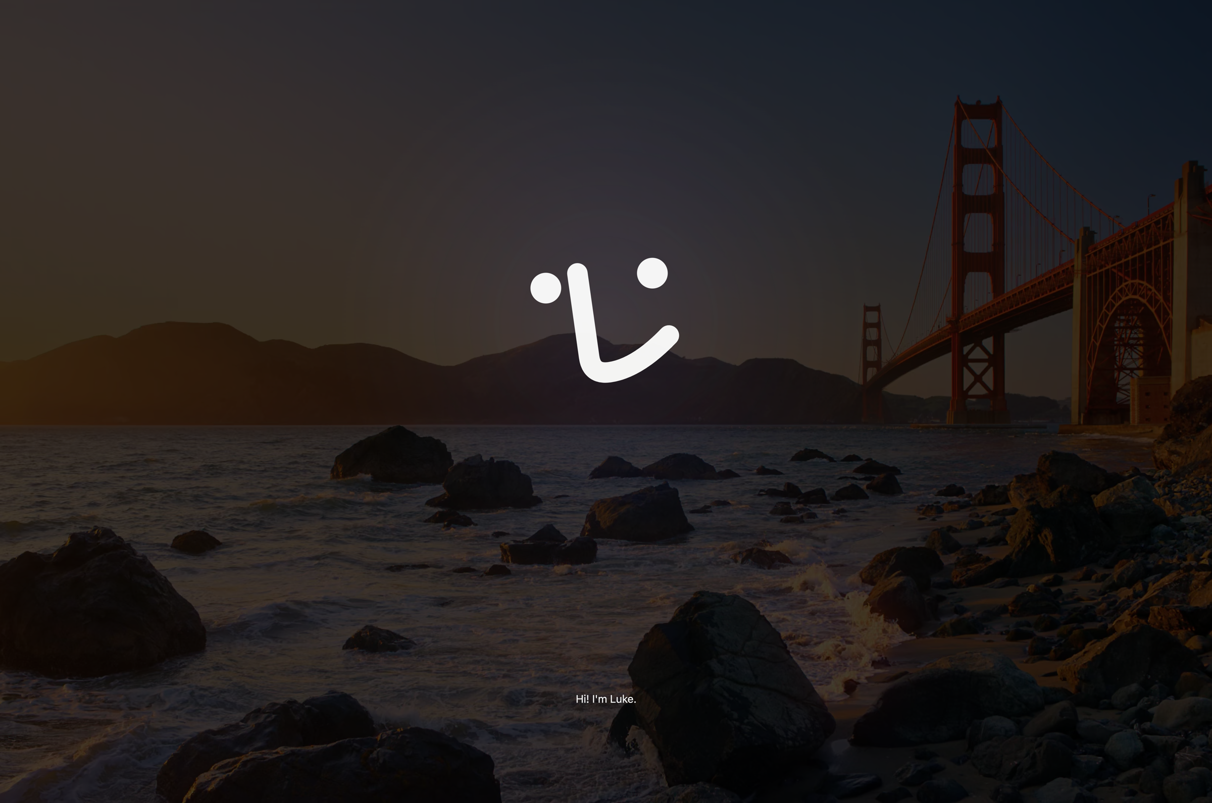 Luke's introduction over the dimmed desktop: his face awake in the middle and his first words, "Hi! I'm Luke.", beneath it.